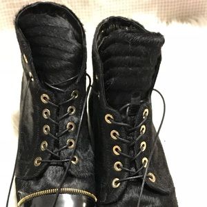Stuart Weitzman Combat Boots with Gold zippers on back. Calf hair.
